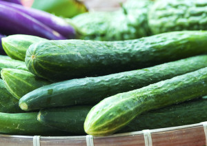 Organic Cucumbers Being Sold In A Market