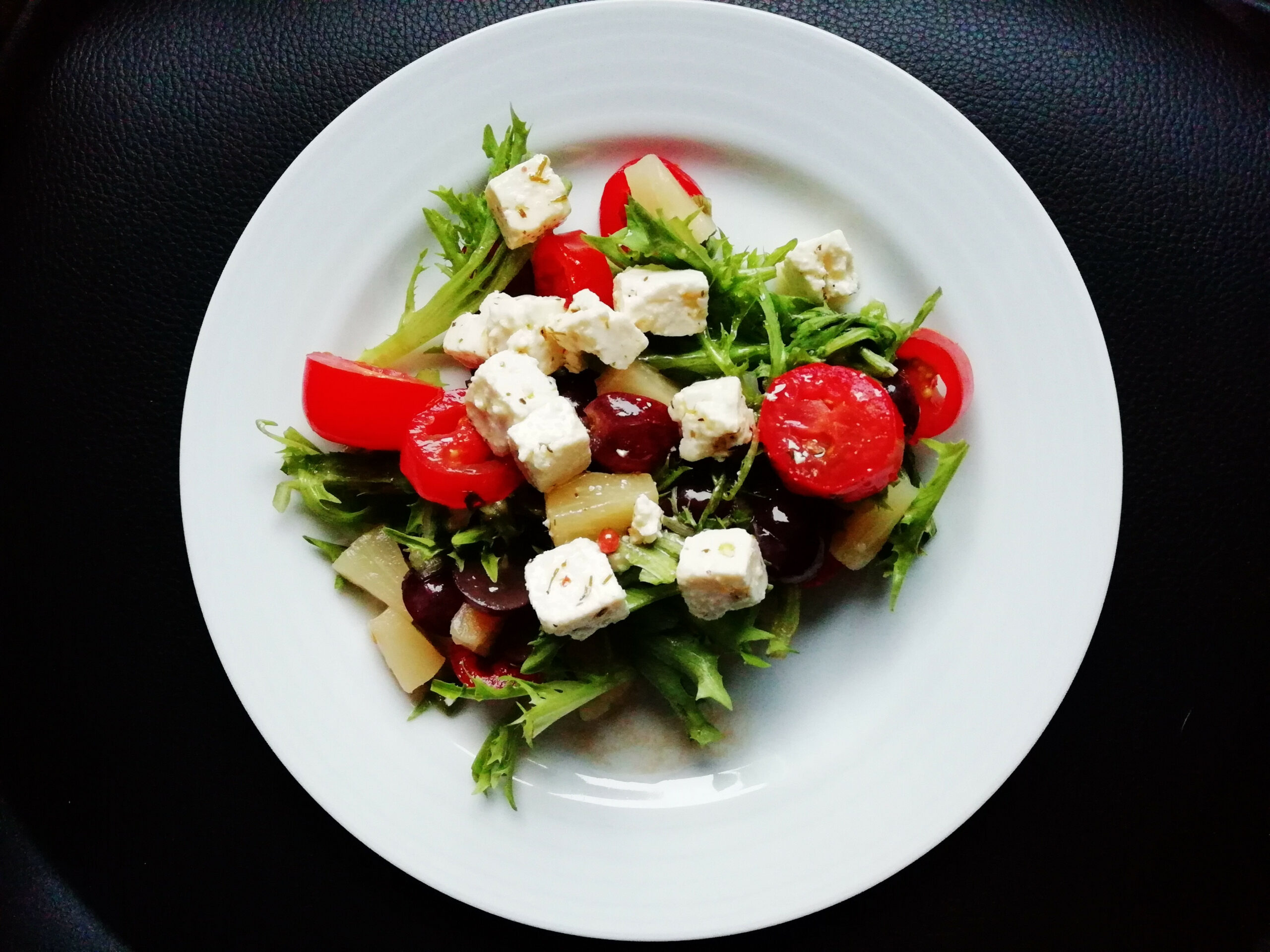 Pear and goat cheese salad in a dish