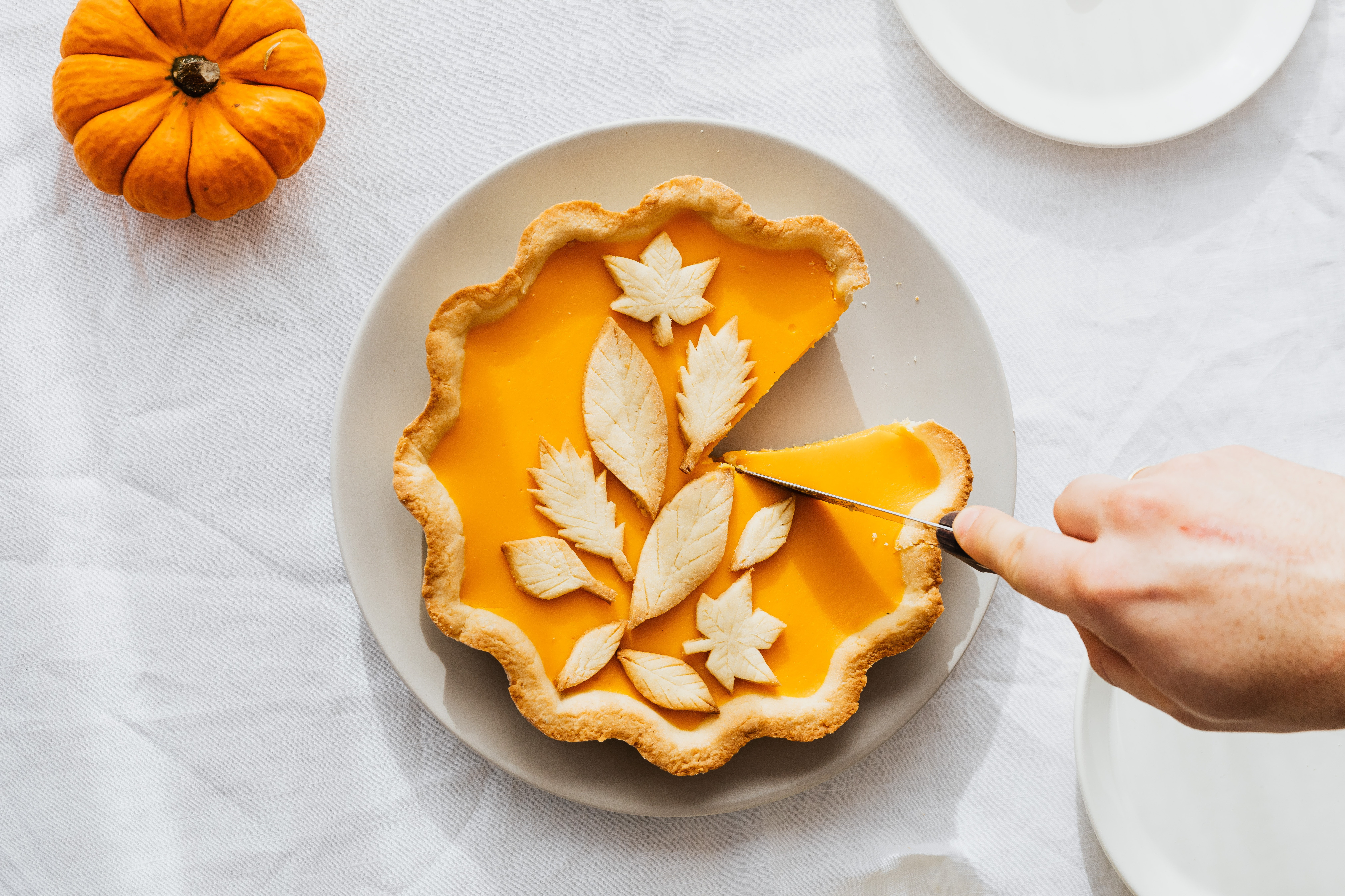 Cutting a pumpkin pie